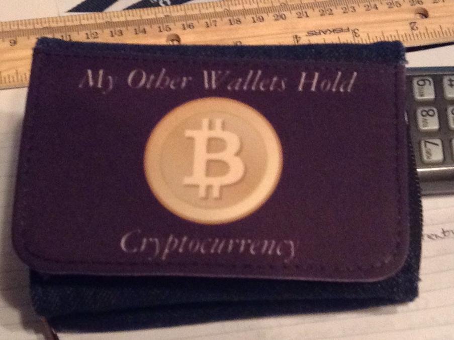 Bitcoin Wallet - My Other Wallets Hold Cryptocurrency - a wallet with a bit bit coin on it