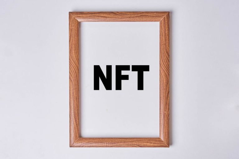 NFT art in the painting frame - a wooden frame with the word ntt in black