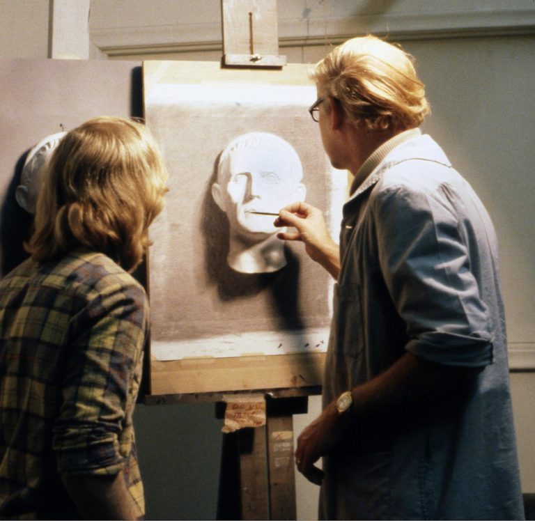 Richard Lack critiquing a cast drawing - a woman is painting a picture of a man